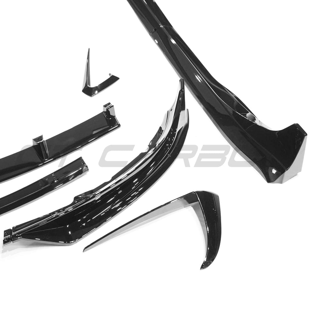 Full gloss black car kit for Tesla Model 3 by CT Carbon, featuring sleek black exterior accessories and trims.