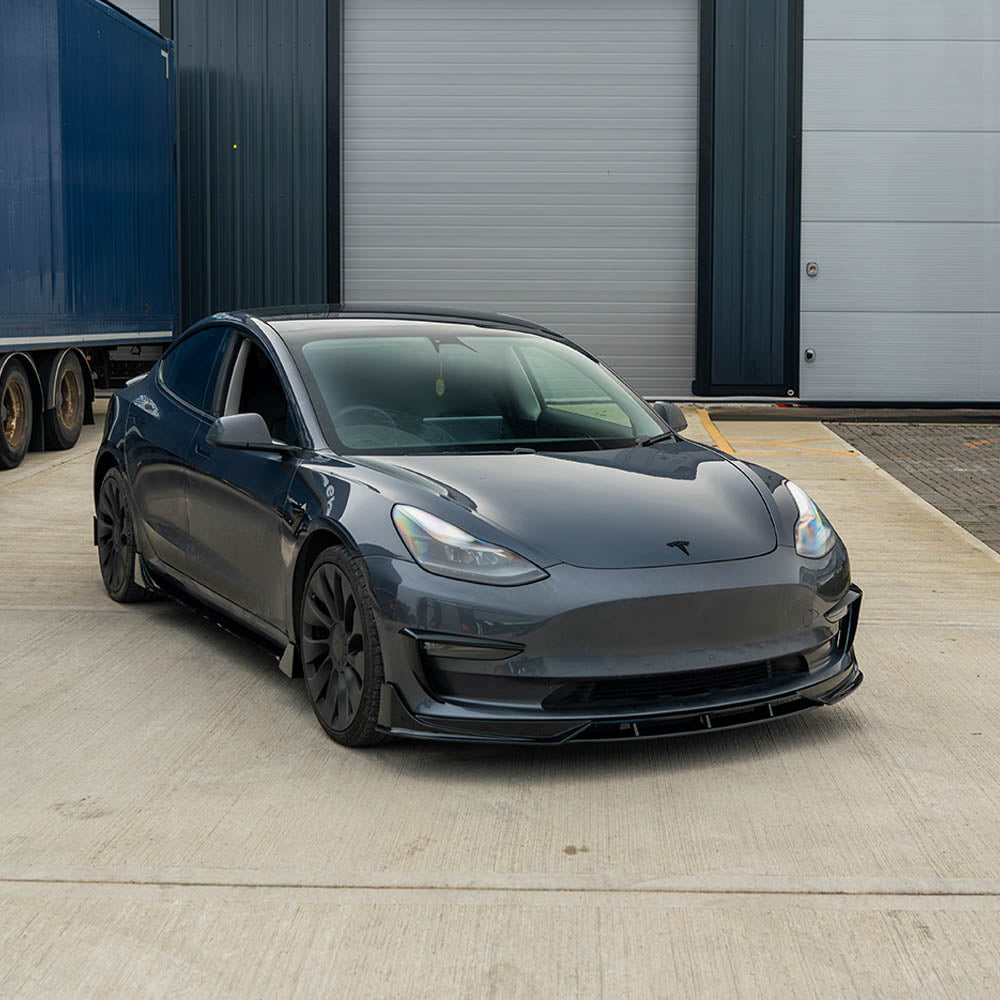 Tesla Model 3 full gloss black car kit by CT Carbon, featuring sleek black exterior accessories and trim enhancements.