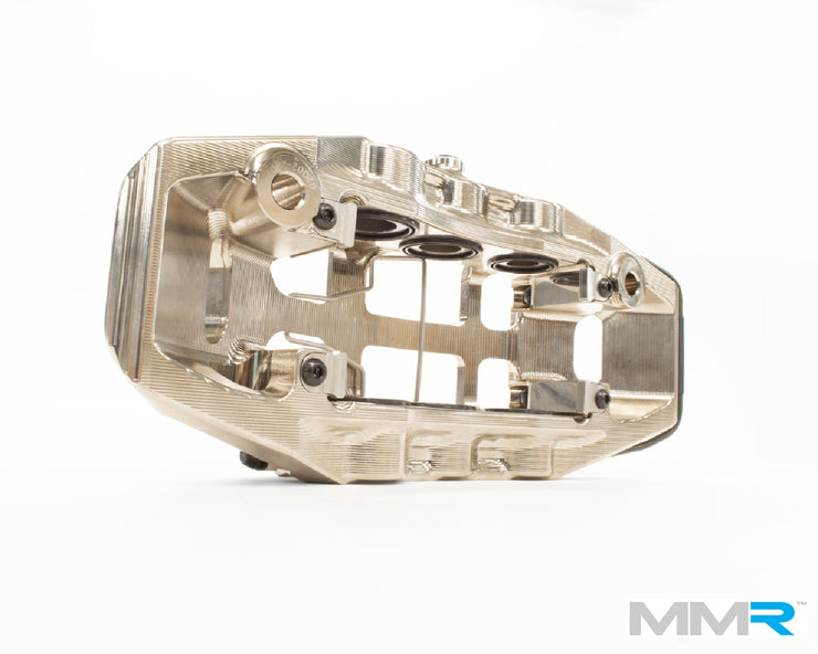 MMX Performance forged monoblock big brake kit installed on BMW F2x and F3x models, featuring large brake rotors and calipers.