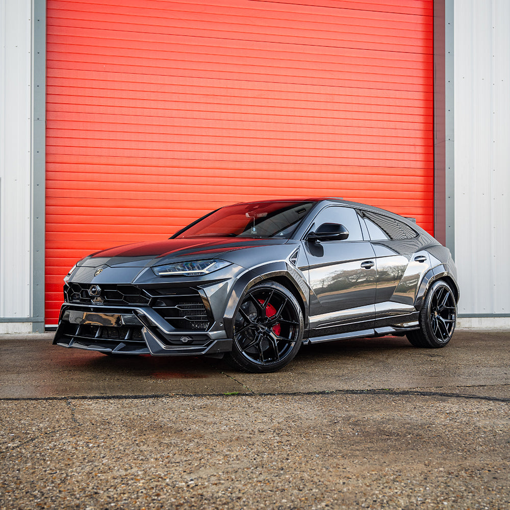 Lamborghini Urus side skirts by CT Carbon with carbon fiber finish, designed to enhance the vehicle's sporty look.