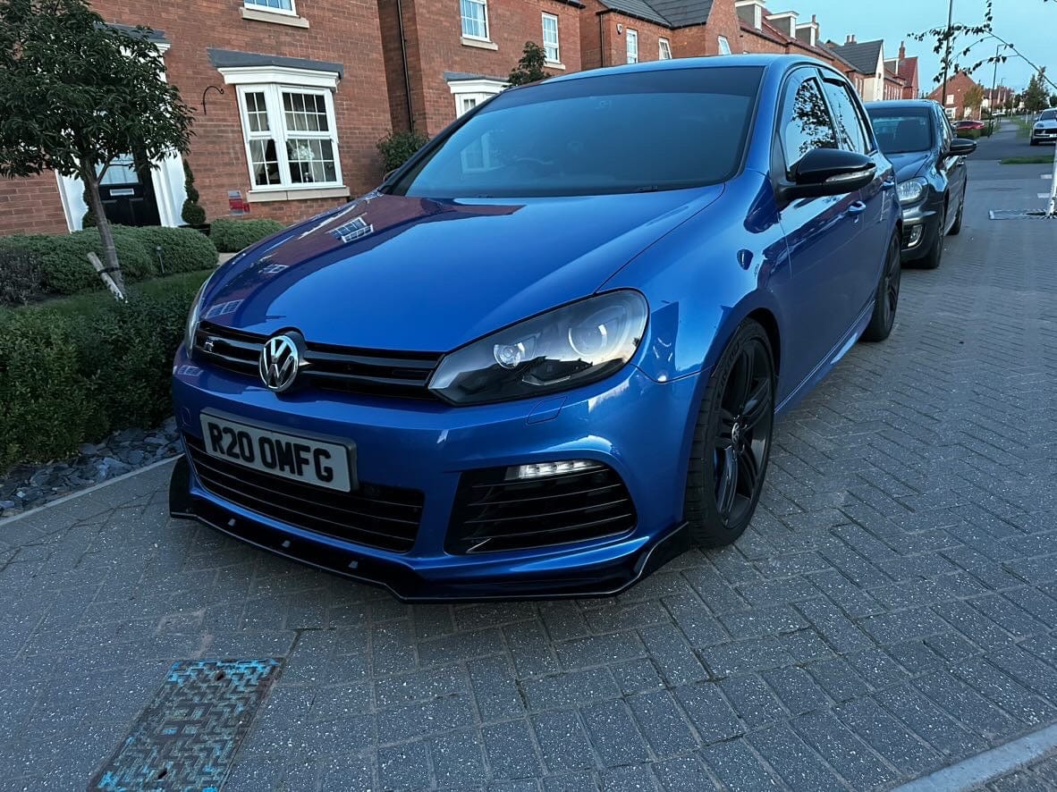 CT Carbon gloss black splitter for Volkswagen Golf R20 MK6 2009-2013, shown installed on the front bumper.