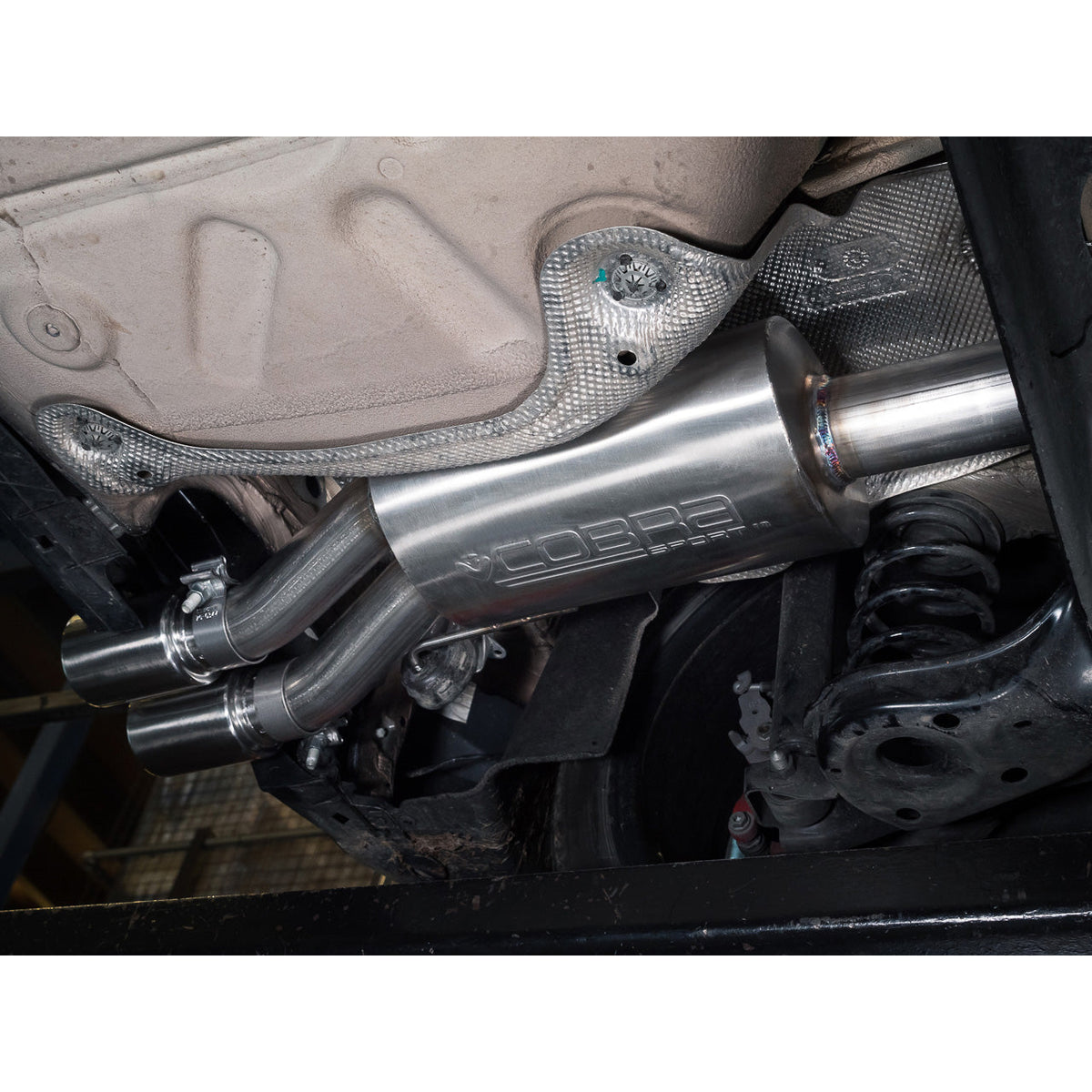 Cobra Sport VW Polo GTI AW Mk6 2.0 TSI turbo back exhaust system shown mounted on the car's undercarriage with polished metal pipes