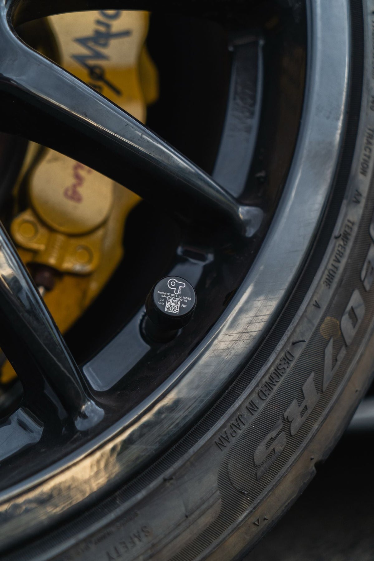 OnTrack External TPMS sensors for tire pressure monitoring, shown with the sensors and installation components.
