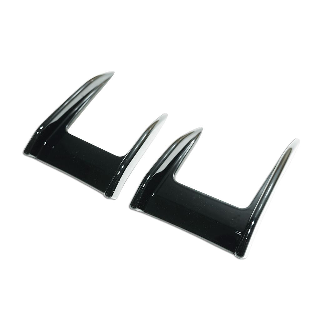 Gloss black front canards for BMW F40 1 Series 2019-2024, made by CT Carbon, shown on a vehicle for enhanced aerodynamics.