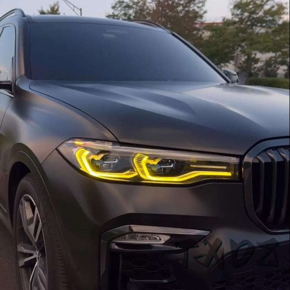 BMW X7 G07 2019-2021 yellow adaptive DRL module set by CT Carbon, close-up of the LED daytime running lights on the vehicle.