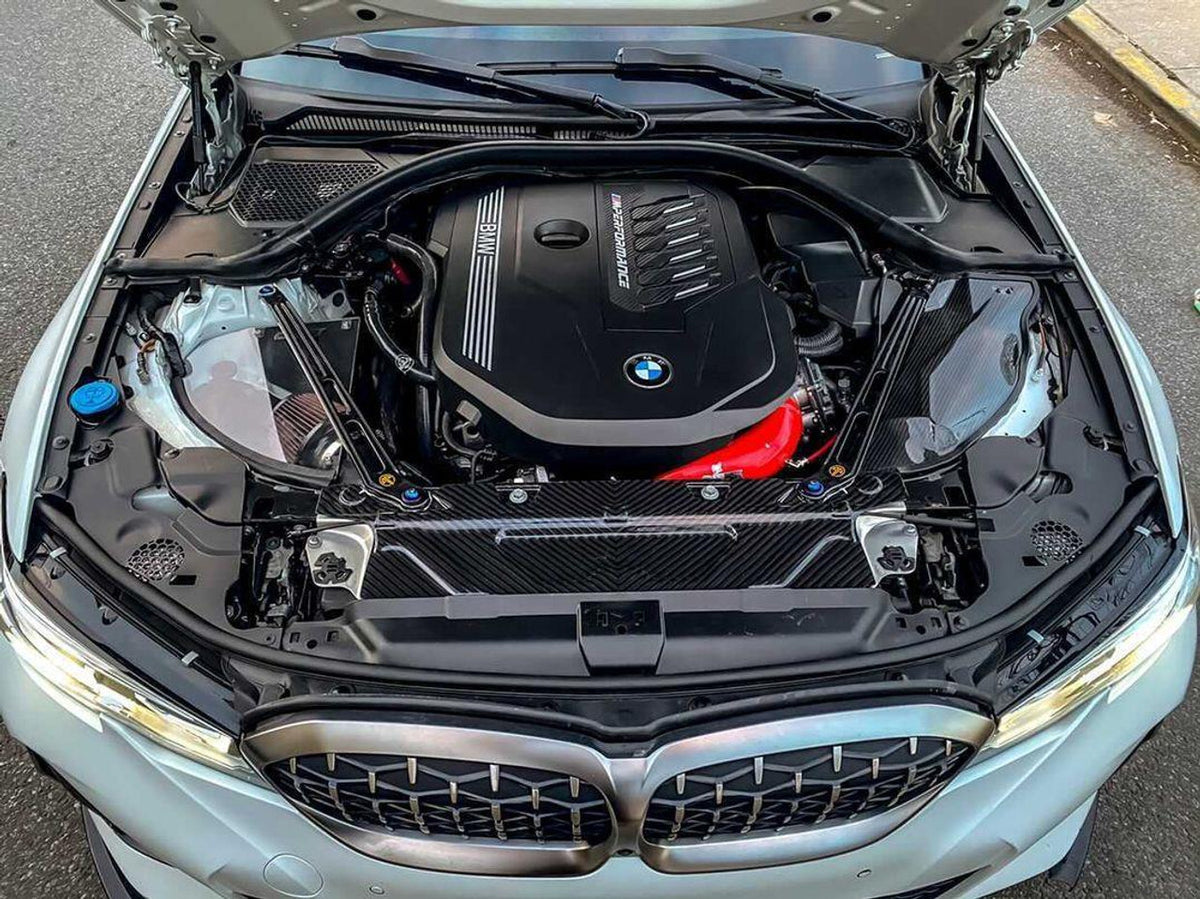 MST Performance BMW M340i induction kit with clear cover, showcasing the sleek, high-performance air intake component.