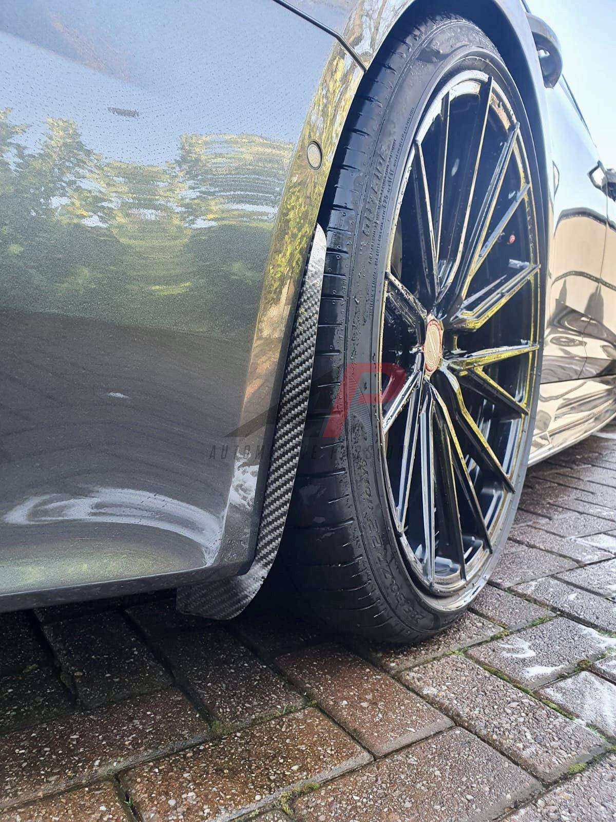 Carbon fiber arch guard set for Audi RS6 C8 (2020+) by Automotive Passion, designed to protect wheel arches with a sleek finish.