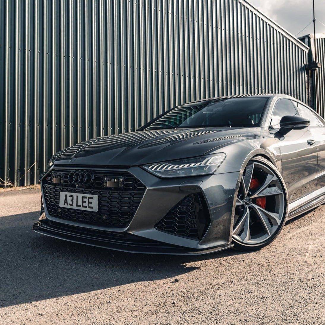 AP Dry Carbon Fibre Front Splitter for Audi RS6 and RS7 C8 models, showcasing lightweight carbon fiber design on the vehicle's front.