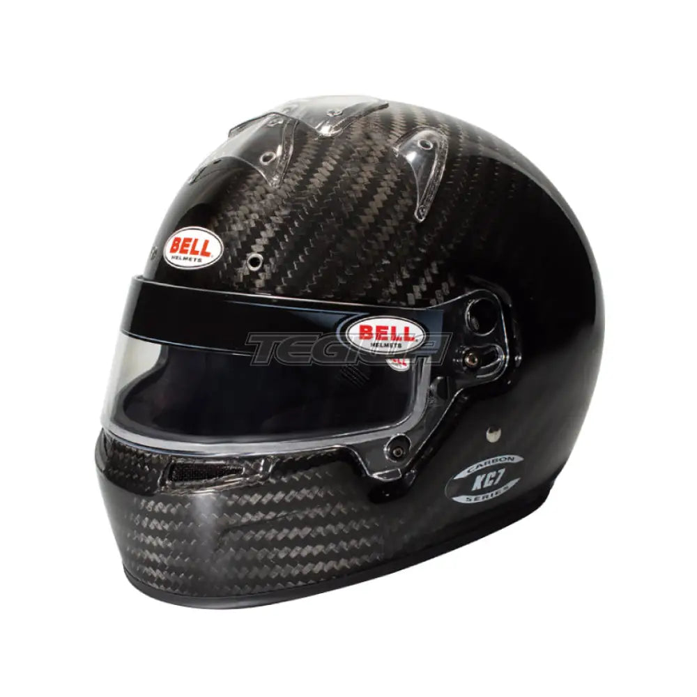 Bell KC7-CMR Carbon Karting Helmet with sleek black finish, aerodynamic design, and clear visor for racing safety and performance.