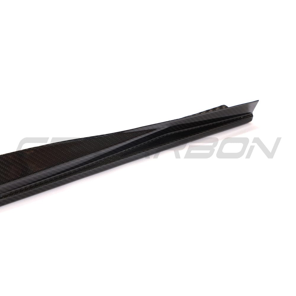 BMW G22 4 Series Carbon Fibre Kit by CT Carbon, including side skirts and diffuser, showcasing sleek black carbon fiber components.