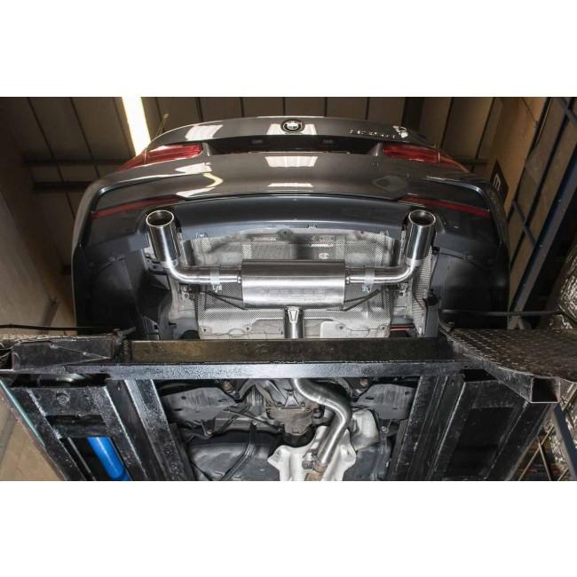 Cobra Sport BMW 335D F30 dual exit exhaust conversion with stylish dual tailpipes and polished metal finish.