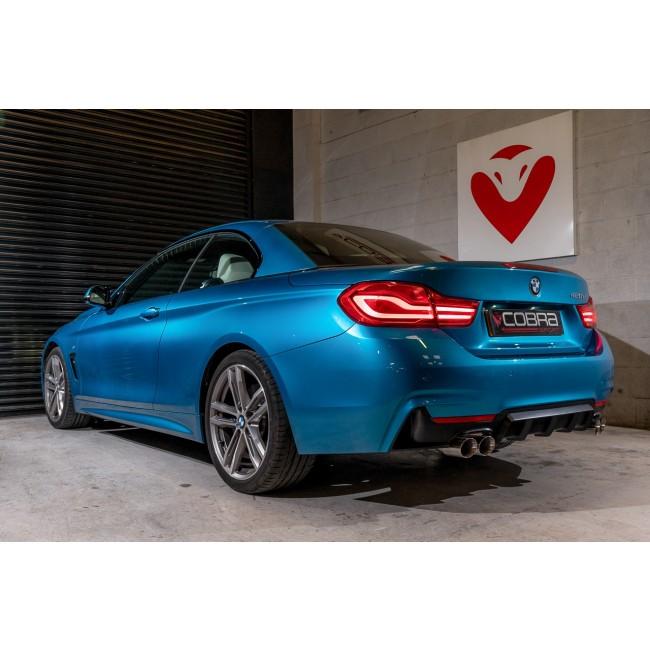 Cobra Sport BMW 420i quad exit M4 style performance exhaust conversion with four polished exhaust tips, rear view.