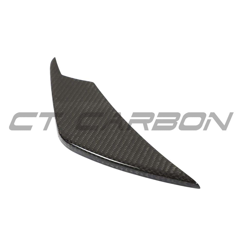 BMW M3 M4 G80 G81 G82 G83 carbon fiber front bumper canards by CT Carbon, showing aggressive aerodynamic design on the car.