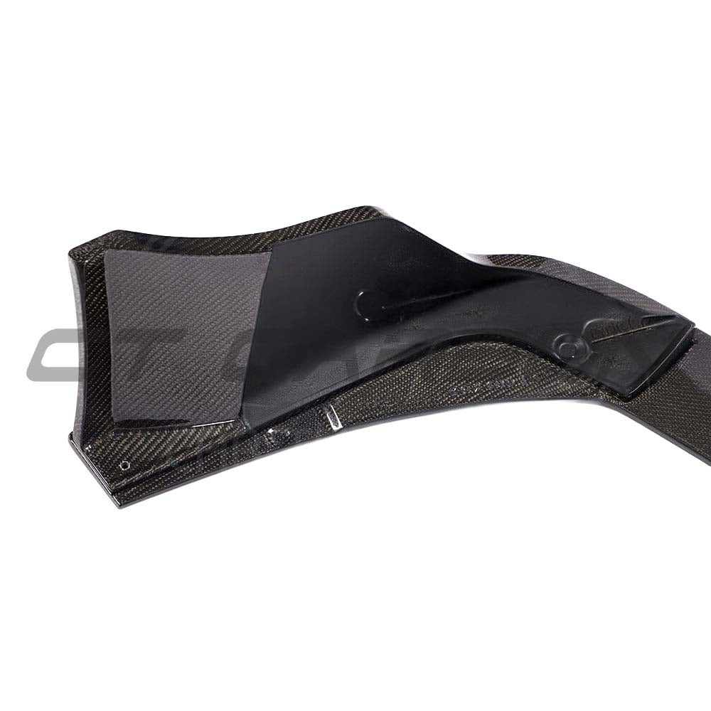 Carbon fiber diffuser for Toyota Supra A90 by CT Carbon, showcasing sleek aerodynamic design and textured carbon fiber finish.