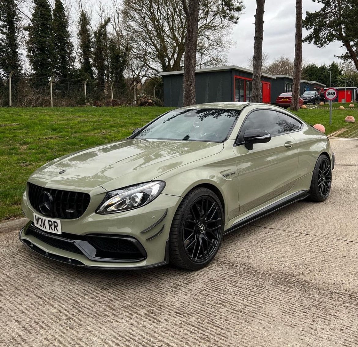 Carbon fibre front bumper canards for Mercedes W205 C63 and C63S, by CT Carbon, shown on the vehicle for enhanced aerodynamics.