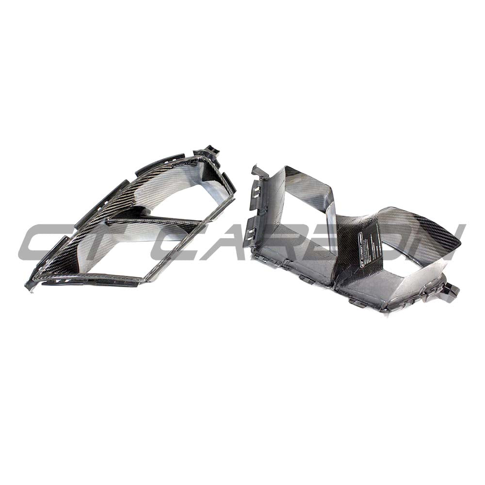 BMW M3 M4 G80 G82 carbon fibre bumper ducts from CT Carbon, showing lightweight, aerodynamic accessory for enhanced vehicle performance.