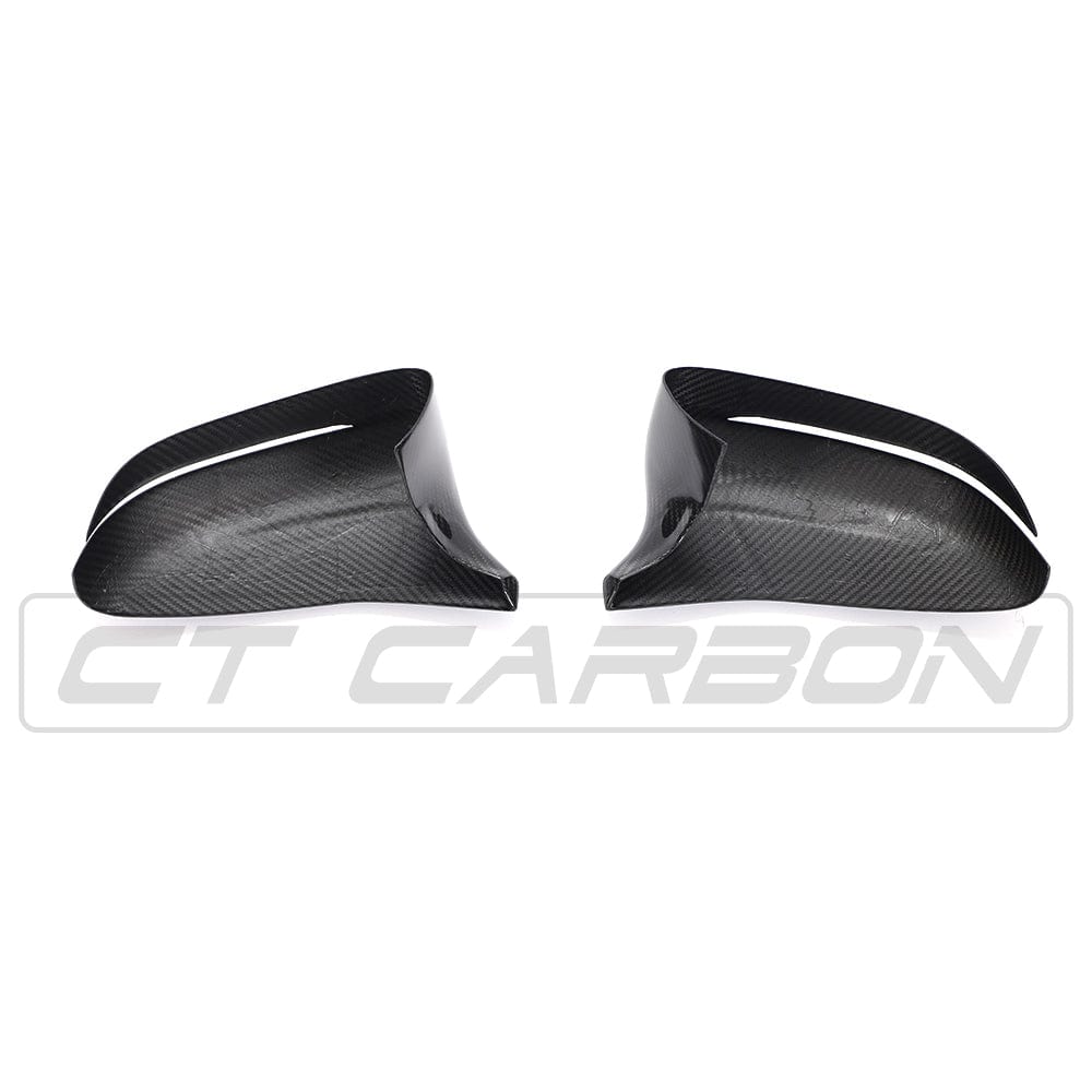 BMW F90 M5 and M5C Competition carbon fiber mirror overlays by CT Carbon, showing RHD mirror covers with a sleek carbon fiber finish.