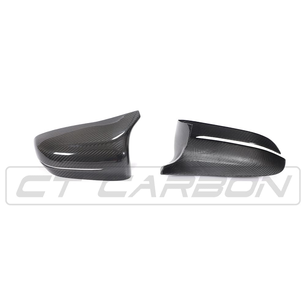 BMW F90 M5 M5C Competition carbon fibre mirror overlay by CT Carbon, showing sleek, textured carbon fibre mirror covers for RHD model.