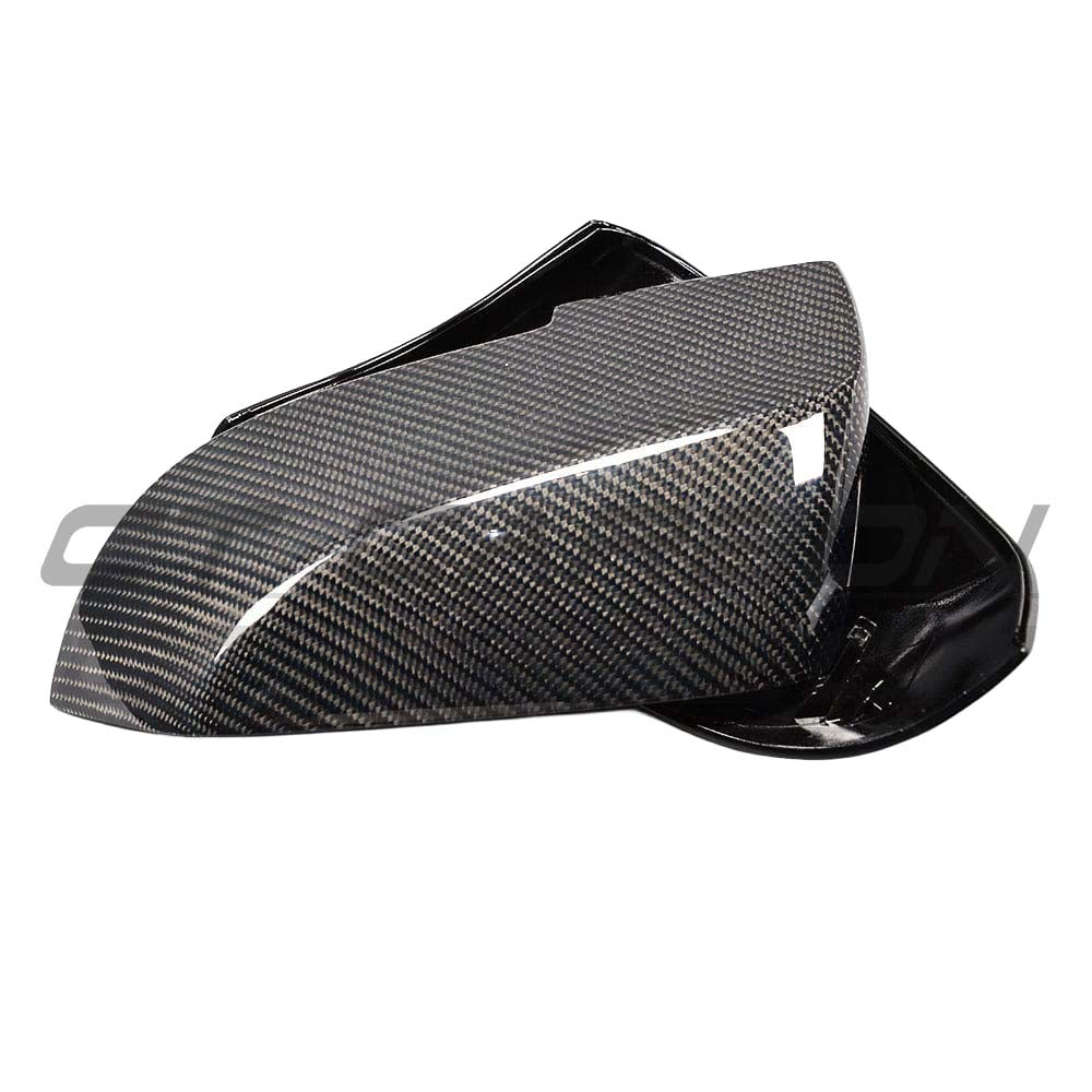 BMW F87 M2 carbon fiber mirror replacements by CT Carbon, OE-style side mirrors with a sleek, lightweight finish.