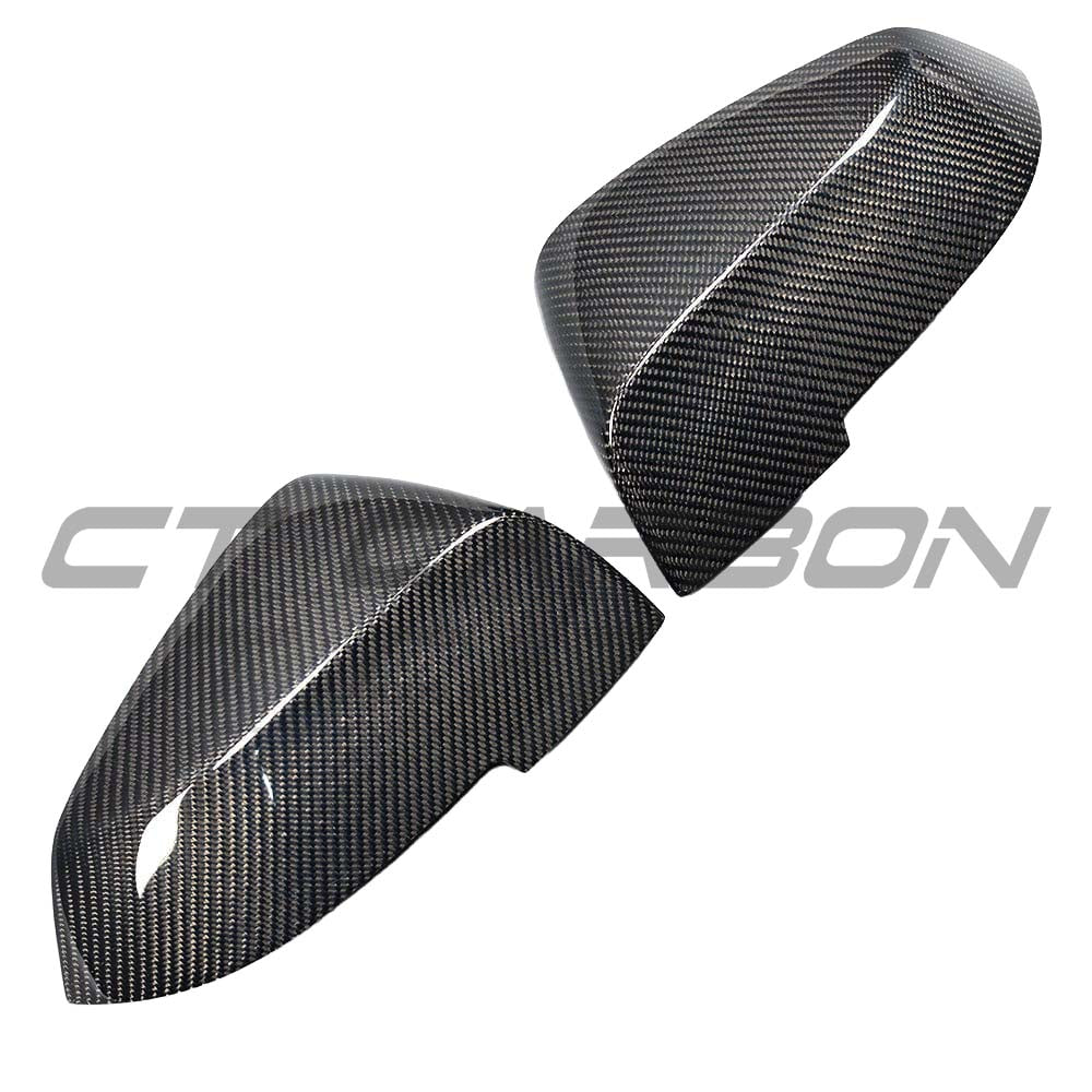 BMW F87 M2 CT Carbon full carbon fiber mirror replacements installed, showcasing sleek, lightweight OE-style design.