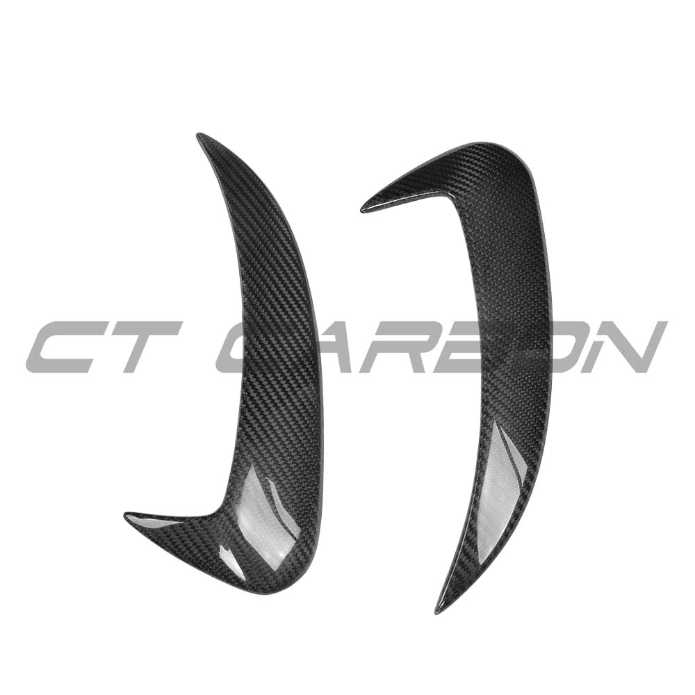 Carbon fibre rear bumper canards for Mercedes W205 C63 and C43 saloon by CT Carbon, shown on the vehicle's rear bumper.
