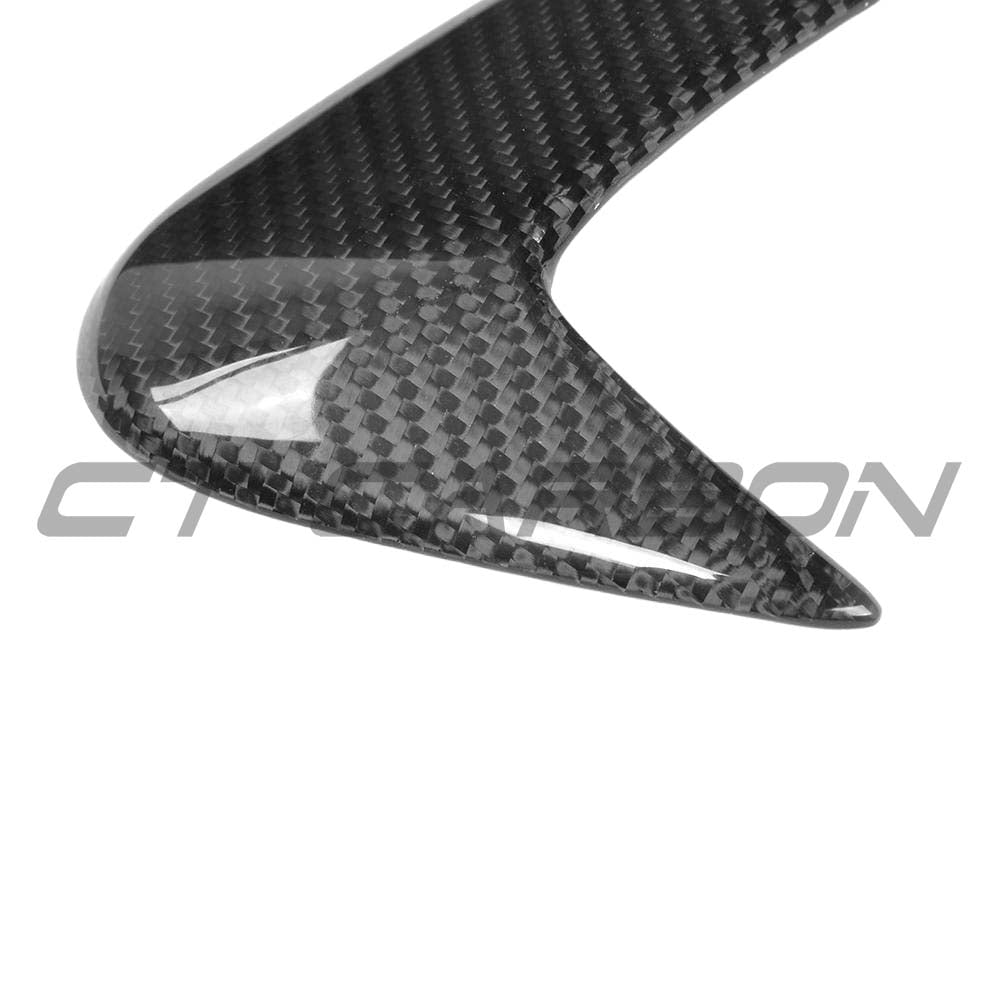 Carbon fibre rear bumper canards for Mercedes W205 C63 and C43 saloon by CT Carbon, shown on the vehicle's rear bumper.