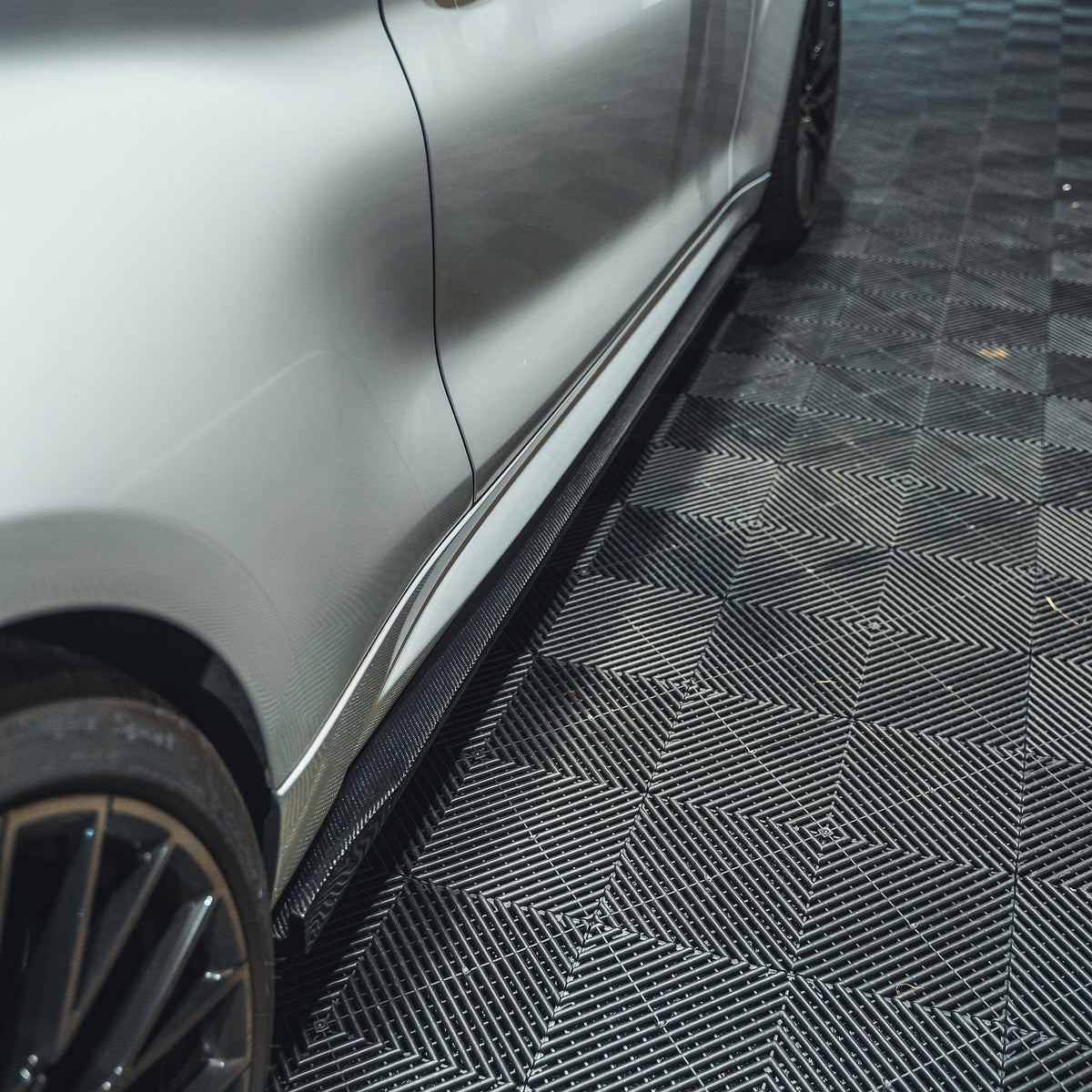 BMW M2 F87 carbon fibre side skirts by CT Carbon, featuring a 3D design for enhanced sporty appearance and aerodynamic performance.