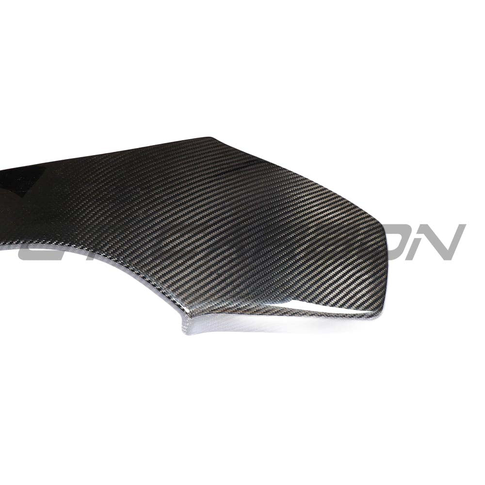 BMW M2C, M3, M4 carbon fibre seat back accessory by CT Carbon, shown from the side with a sleek, textured carbon finish.