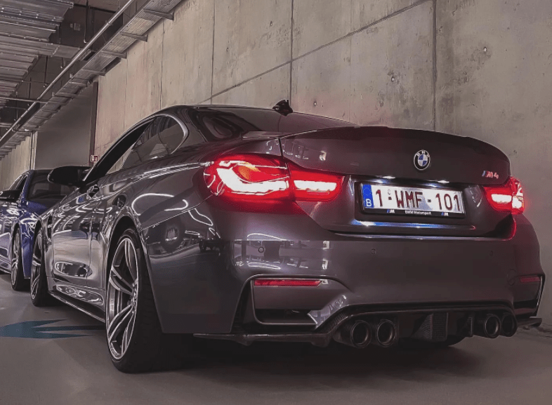 BMW M3 M4 F80 F82 F83 carbon fibre diffuser with DTM light by CT Carbon, showcasing a sleek aerodynamic design.