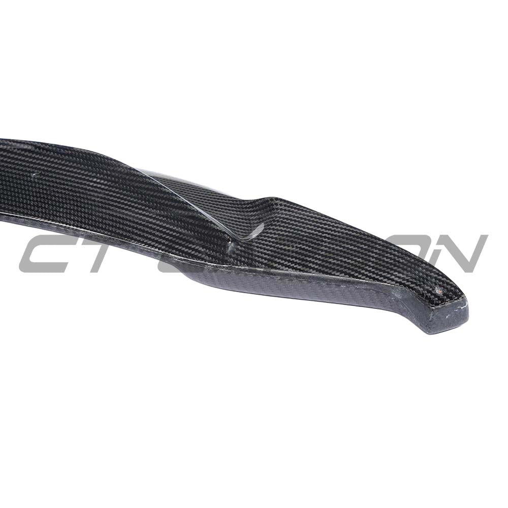 BMW M3 M4 F80 F82 F83 carbon fiber splitter by CT Carbon, showing the V-style front splitter on the vehicle.