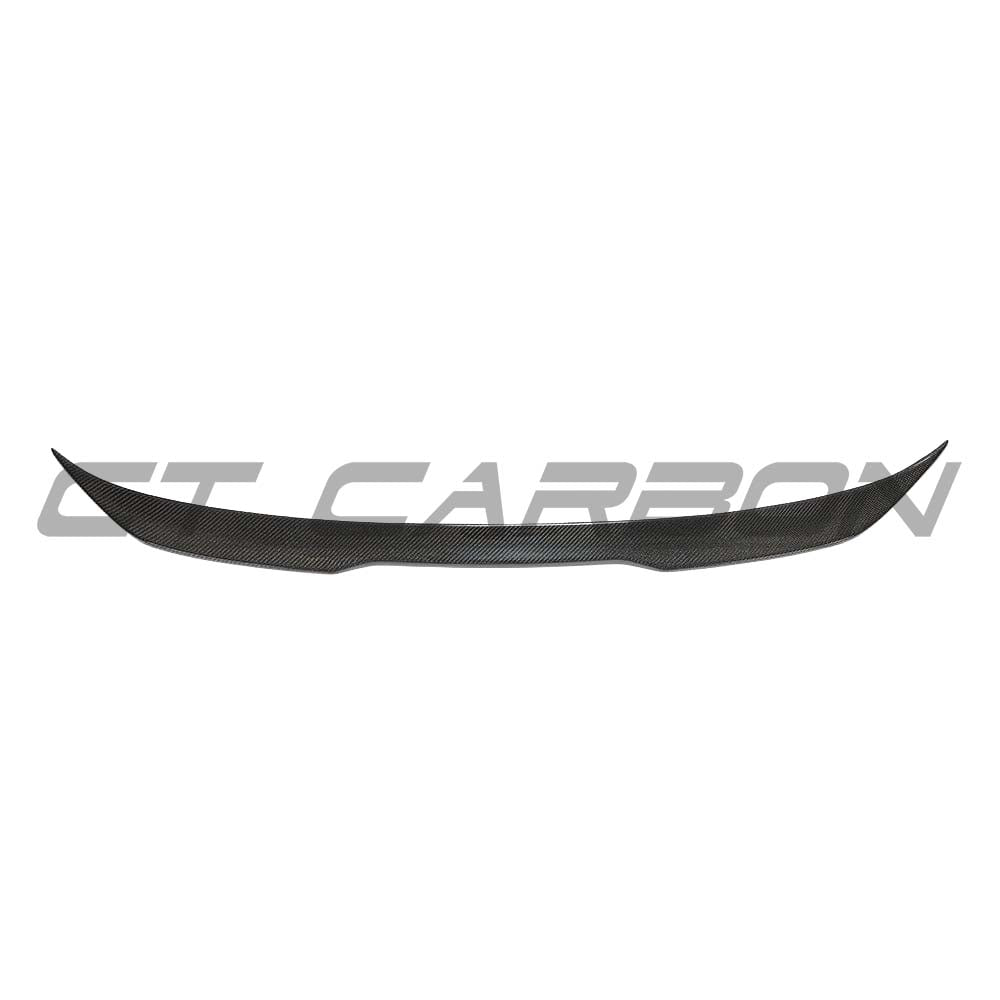 BMW M5 F90 and G30 5 Series carbon fibre spoiler by CT Carbon, showing the sleek, aerodynamic design and textured carbon finish.