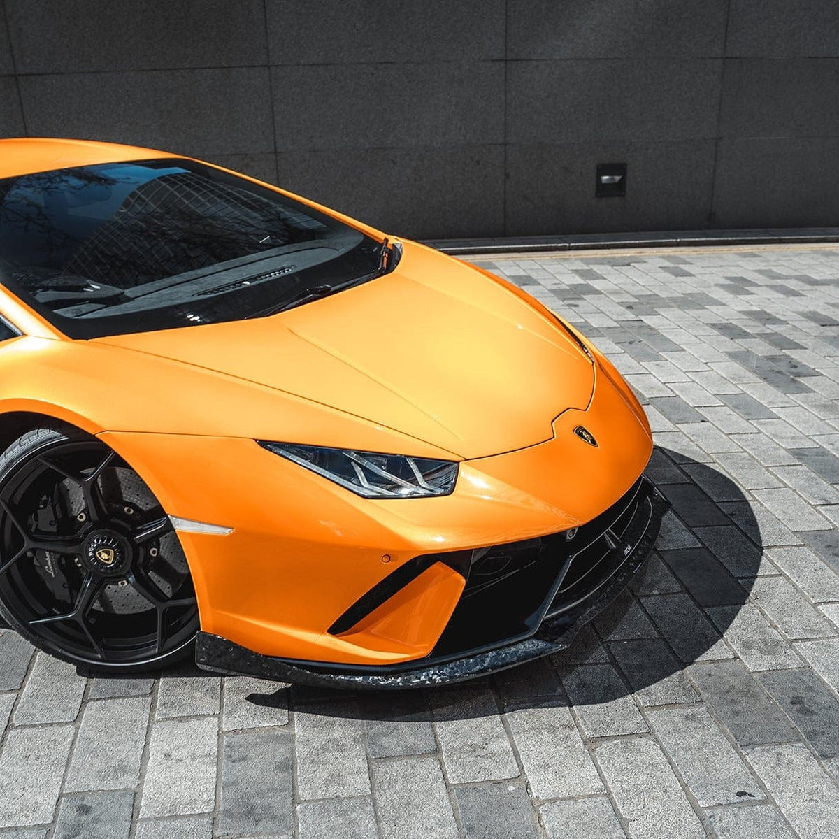 Carbon fiber splitter for Lamborghini Huracan Performante by CT Carbon, featuring forged construction and aerodynamic design.