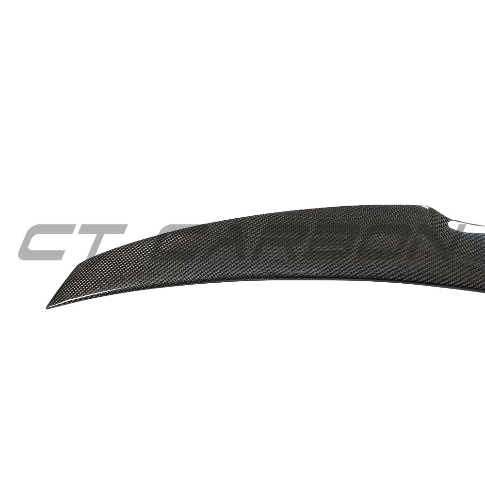BMW M4 F82 carbon fibre spoiler by CT Carbon, MP style, showing sleek aerodynamic design on the car's rear for enhanced performance.