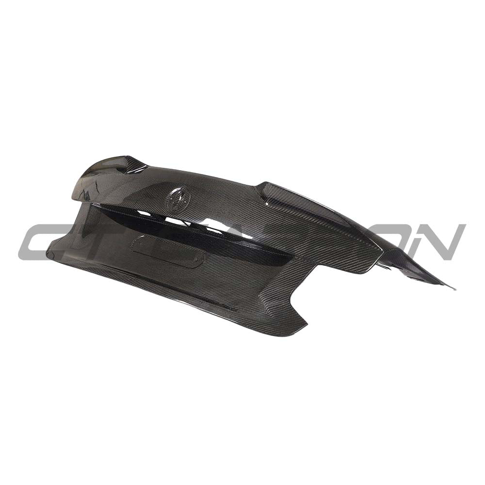 BMW F87 M2 Carbon Fibre Ultimate Kit by CT Carbon, including bootlid and vehicle parts, showcasing sleek, lightweight carbon fiber design.