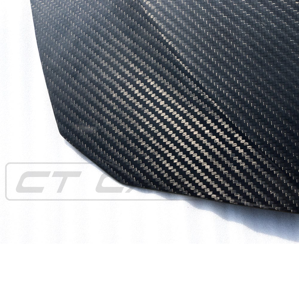 BMW M3 M4 F80 F82 F83 carbon fiber bonnet by CT Carbon, GTS style, lightweight and aerodynamic car hood on a sleek vehicle.