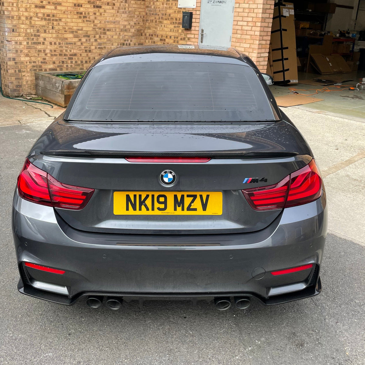 BMW M4 F83 & F33 4 Series carbon fibre spoiler by CT Carbon, showing sleek V2 rear spoiler on car with performance design