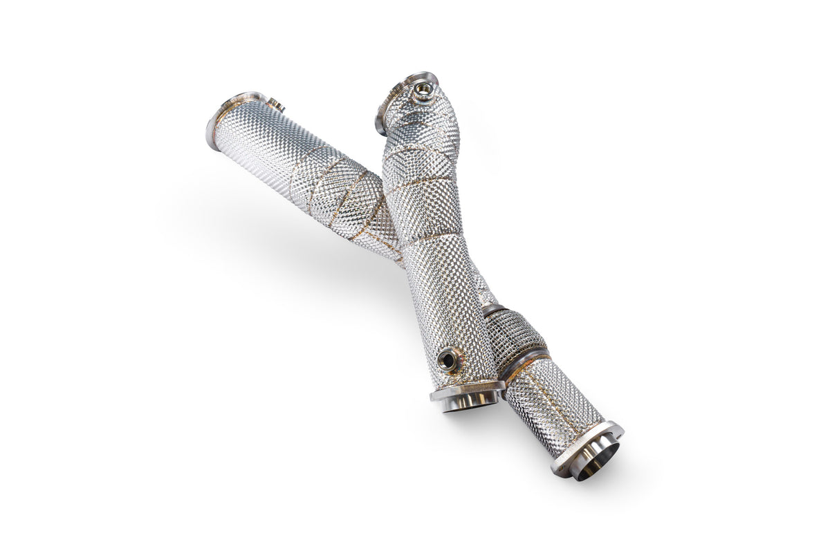 Scorpion BMW M2 G87, M3 G80/G81, M4 G82 de-cat downpipes installed on performance exhaust system, showing metallic pipes and fittings.