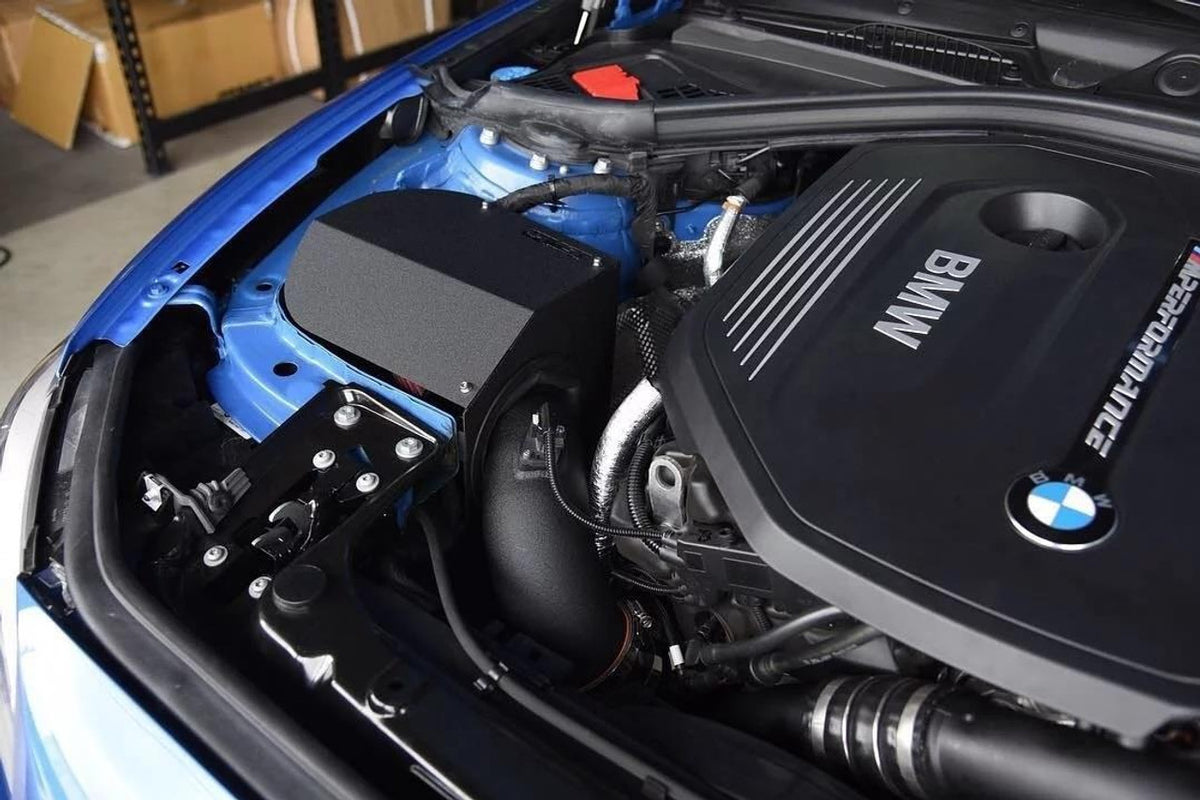 MST Performance induction kit for 3.0 B58 BMW showing air intake components and hoses with brand logo visible