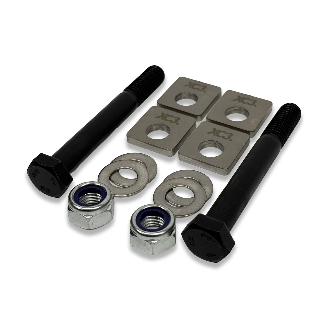 BMW M2, M3, M4 rear camber lockout shims by XC3 Engineering, showing close-up of shim installation on suspension components.