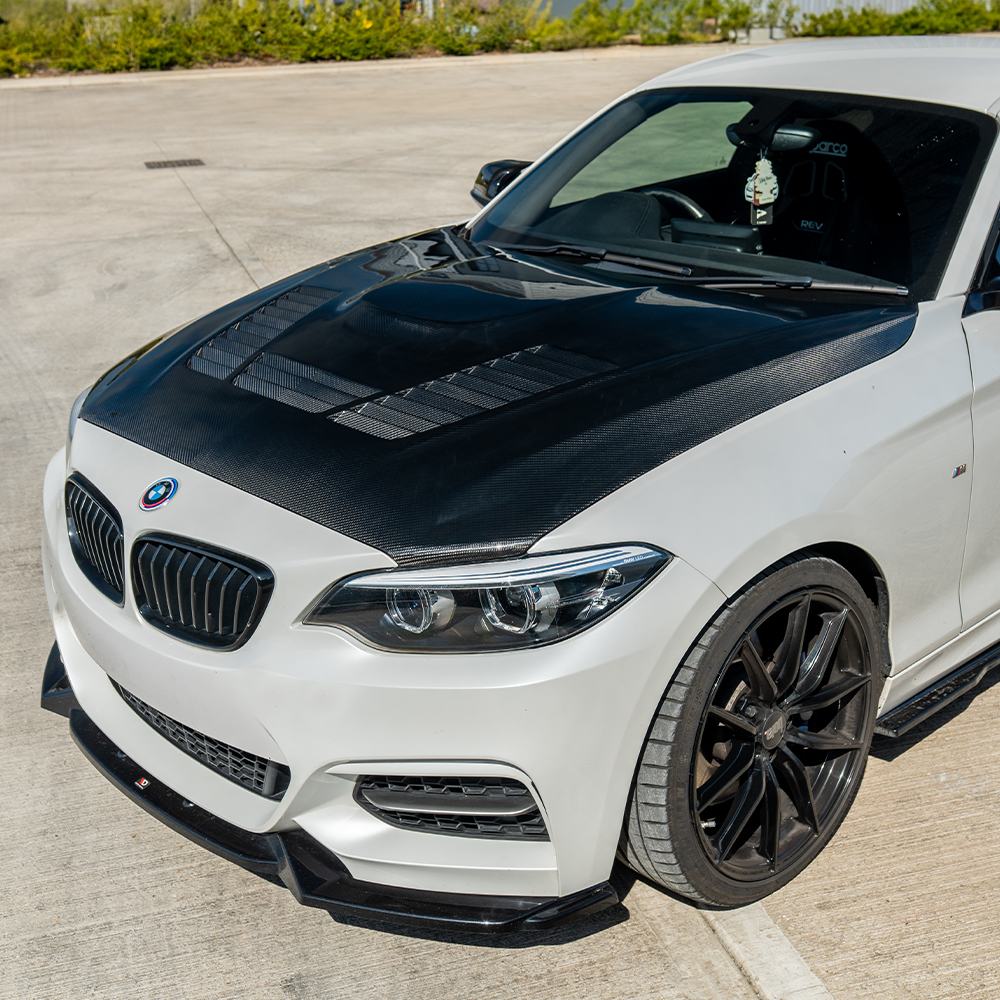 BMW M2 M2C F87 and 1 Series F20 F22 carbon fiber bonnet by CT Carbon, showcasing lightweight, aerodynamic design.