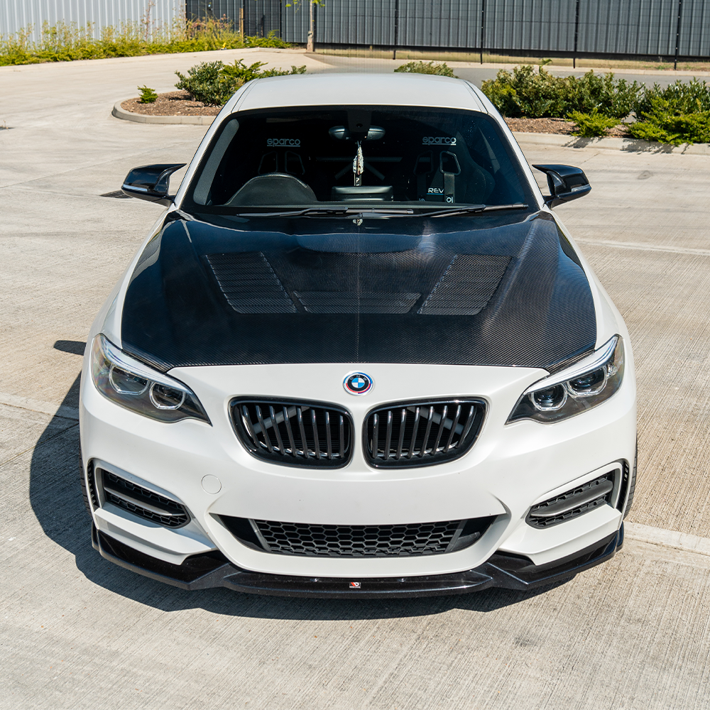 BMW M2/M2C F87 and 1&2 Series carbon fiber bonnet by CT Carbon, showcasing lightweight, aerodynamic car hood with a sleek finish.