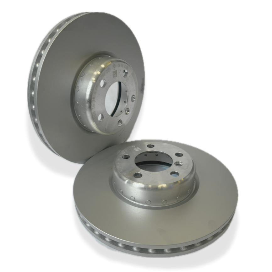 Genuine BMW front brake discs and brake pads for 1, 2, 3, and 4 Series vehicles, showing new brake components installed.