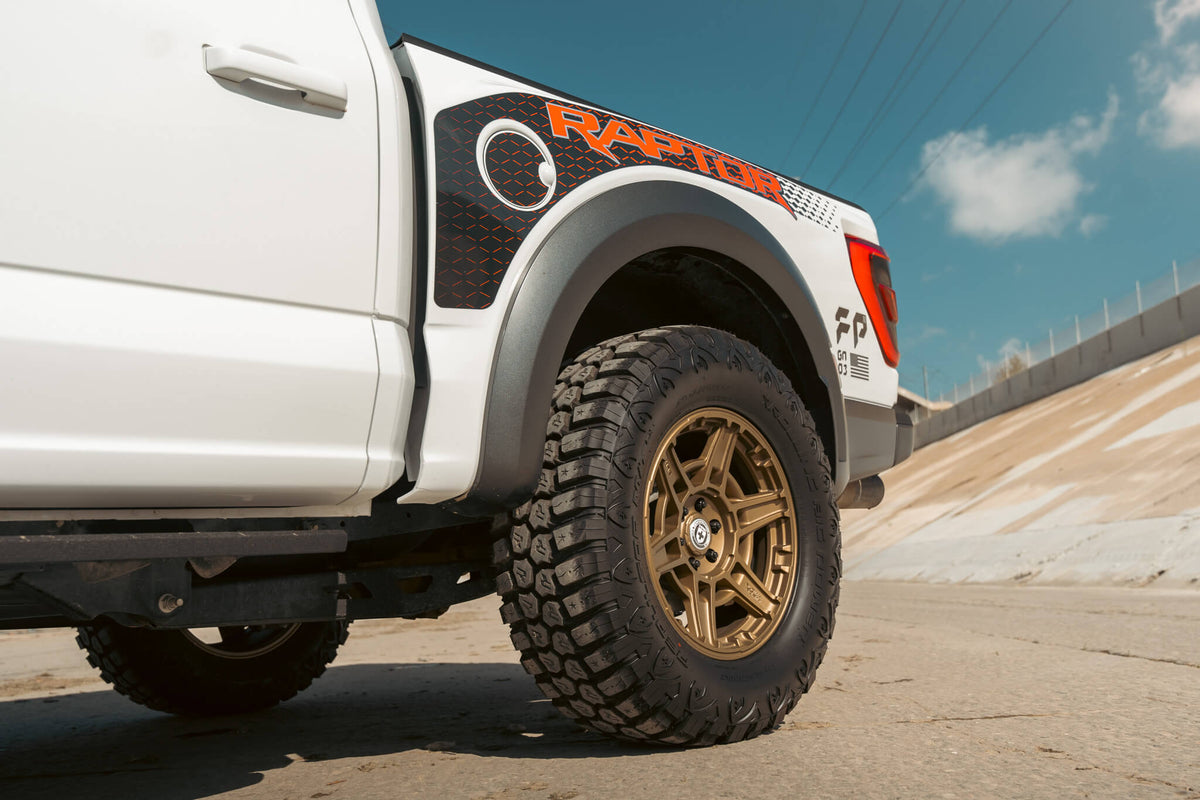HRE PERFORMANCE WHEELS FT1 alloy wheels with multi-spoke design and polished finish, mounted on a vehicle.