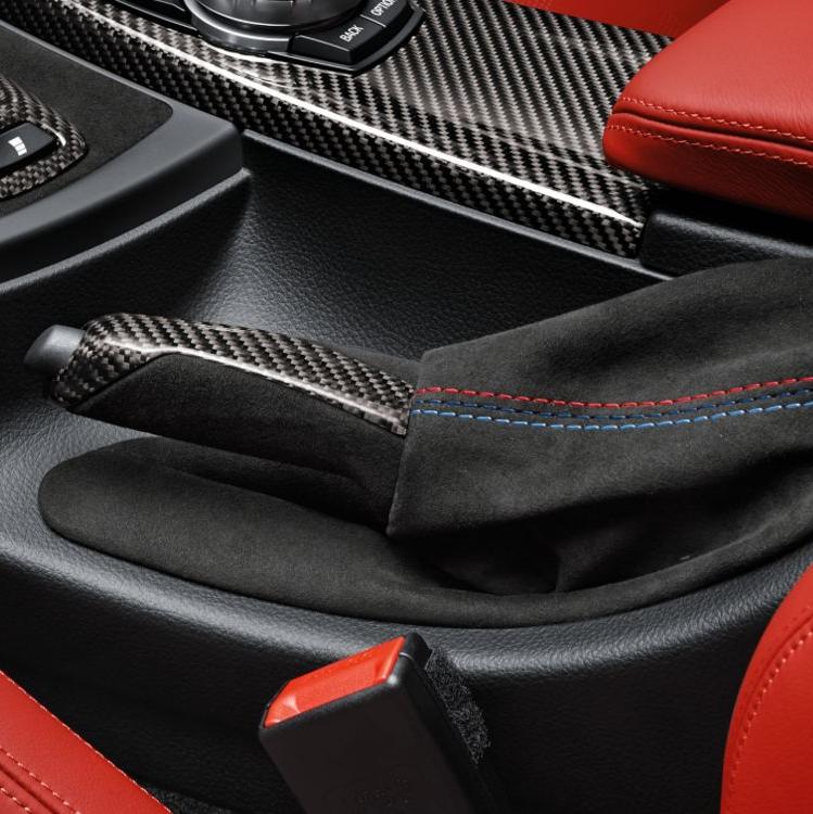 Genuine BMW M Performance carbon Alcantara handbrake lever and gaiter for M3 M4 interior trim, featuring sleek black finish and stitching.