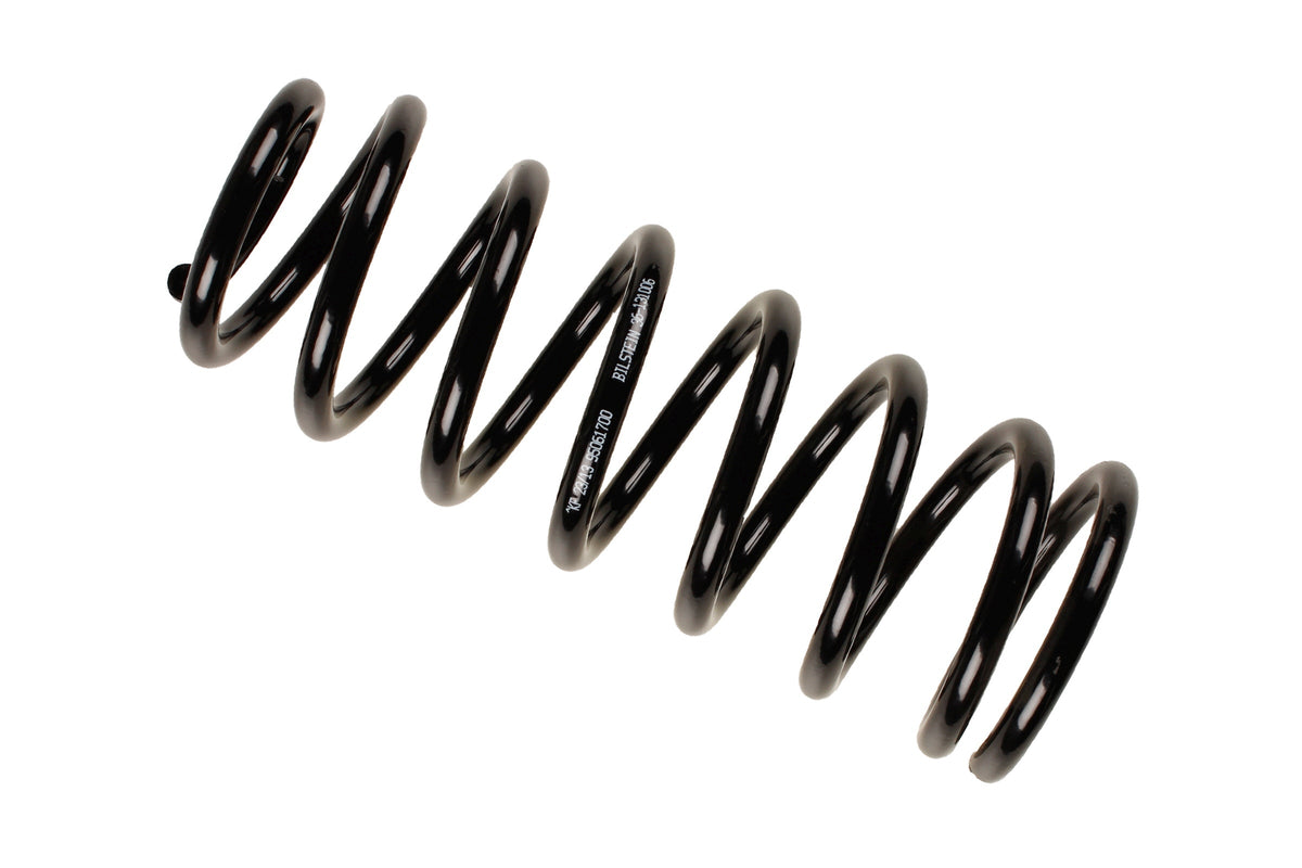 Bilstein B3 OE replacement coil spring for Audi 100 C4 4A, part number 36-131006, shown installed on vehicle suspension.