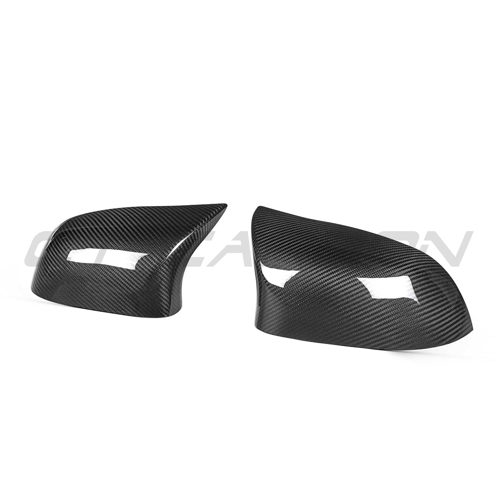BMW X5/X6 F15/F16 carbon fibre mirrors by CT Carbon, close-up of sleek, aerodynamic side mirrors with carbon fiber finish.