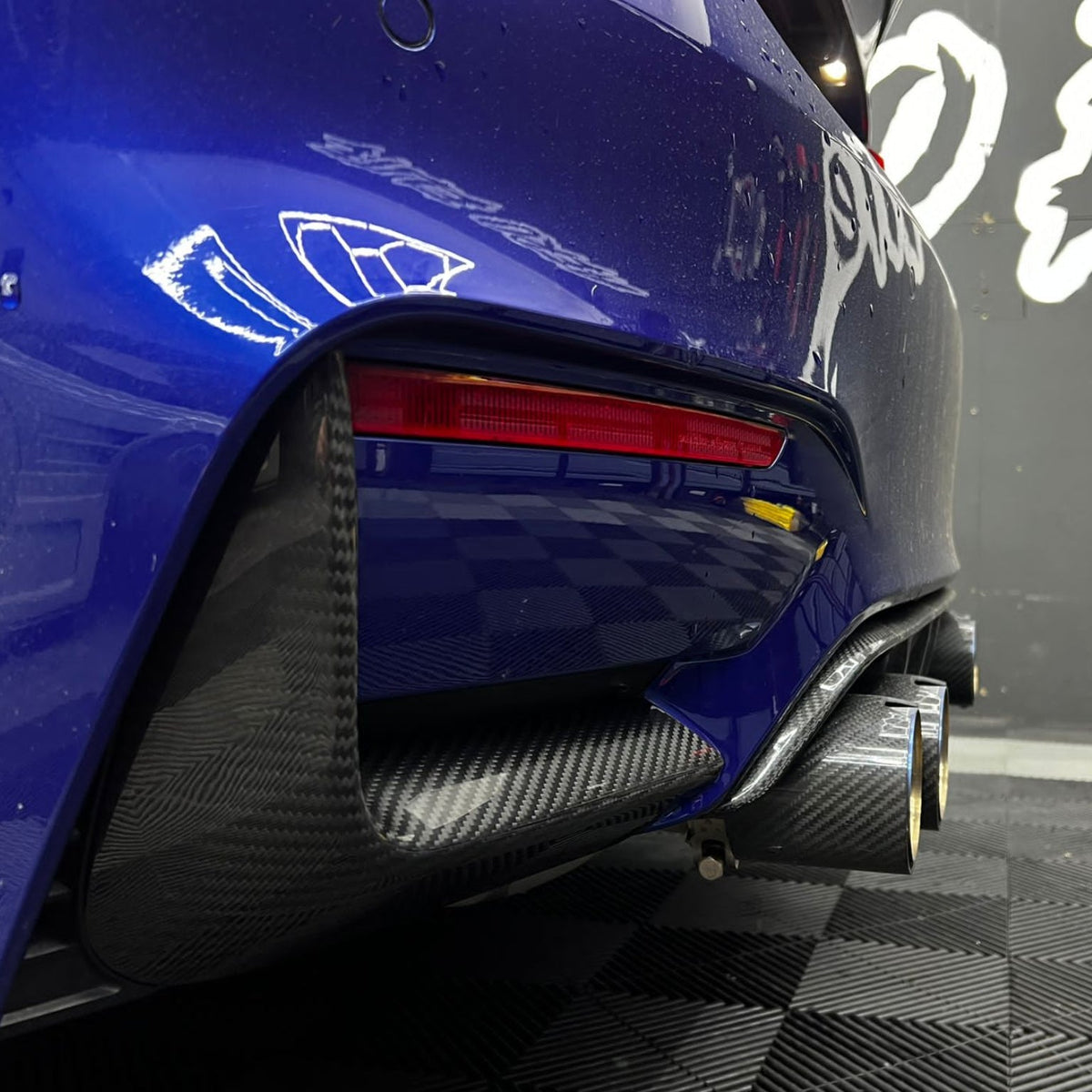 BMW M3 and M4 F80 F82 F83 carbon fiber rear bumper canards by CT Carbon, featuring sleek aerodynamic design.