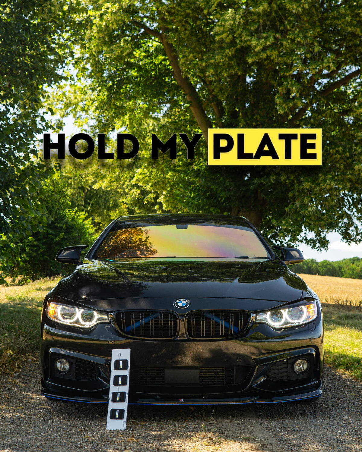 Hold My Plate front bumper magnetic number plate holder kit attached to a vehicle's front bumper.
