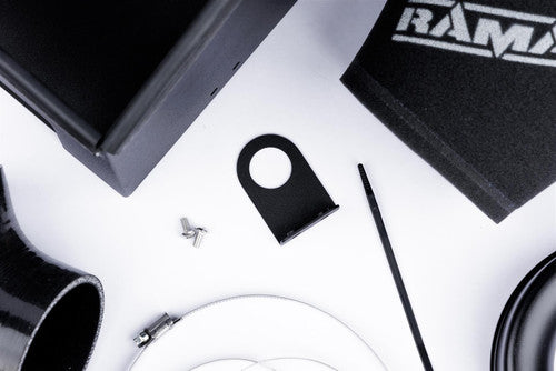 Ramair cone air filter induction kit installed in Audi RS3 8V TTRS 2.5 TFSI showing the black filter and intake piping.