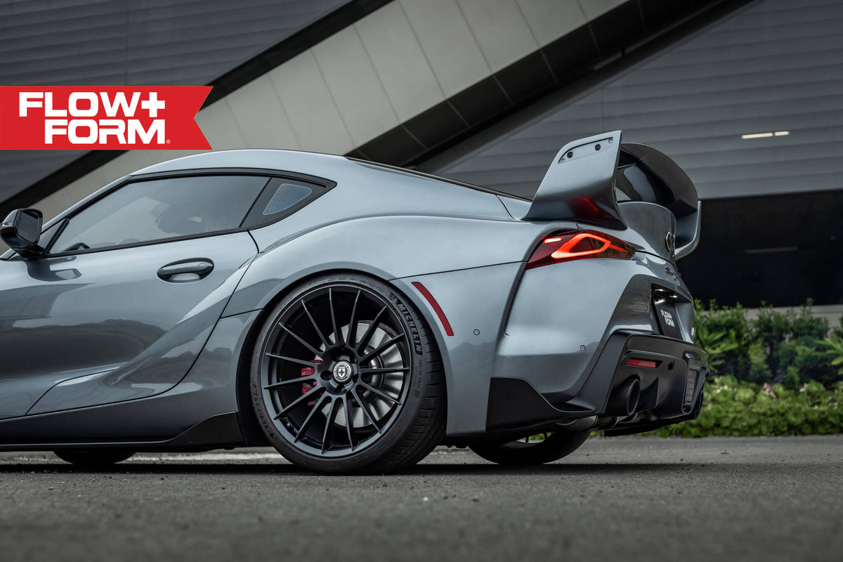 HRE Performance Wheels FF15 alloy wheel set with multi-spoke design and polished finish, displayed on a vehicle.